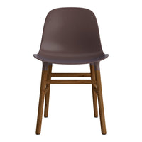 Modern brown plastic chair with a sleek design and wooden legs, featuring a smooth finish and minimalistic style.