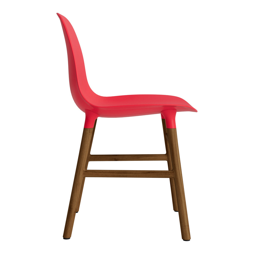 Red chair with a smooth design and wooden legs, featuring a contemporary and vibrant color scheme.