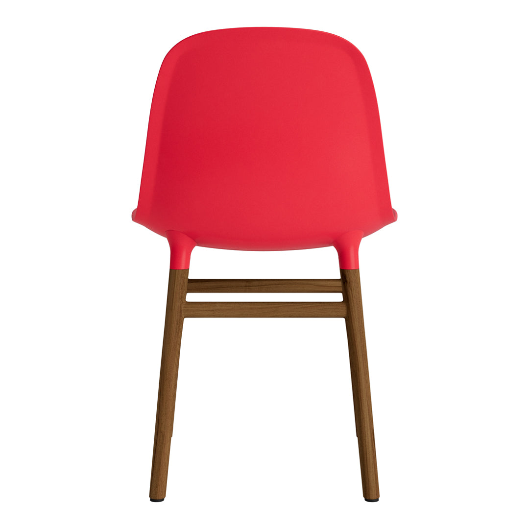 Red plastic chair with a smooth finish and brown wooden legs, featuring a sleek, modern design.