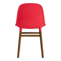 Red plastic chair with a smooth finish and brown wooden legs, featuring a sleek, modern design.
