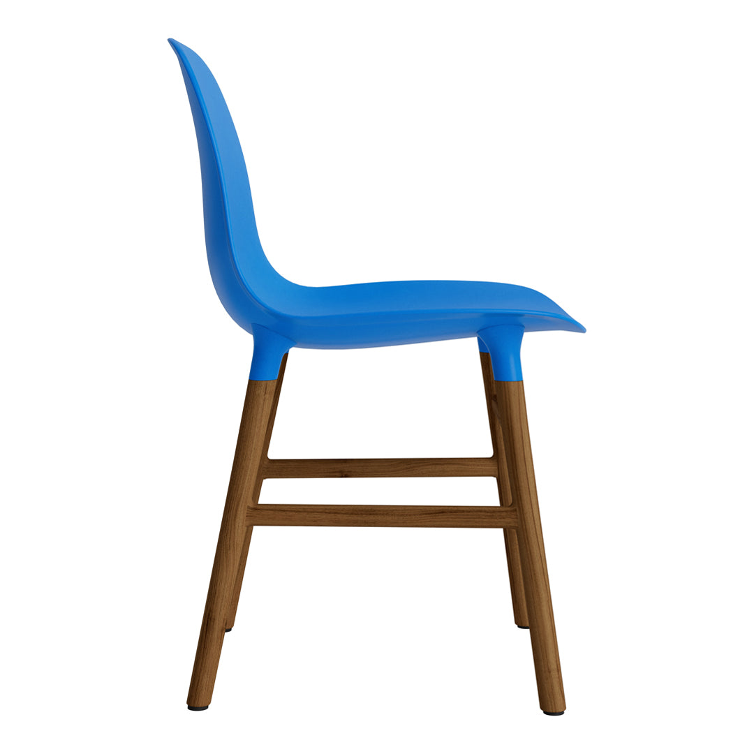 Side view of a blue plastic chair with a natural wood base, showcasing a sleek modern design. Perfect for stylish decor.
