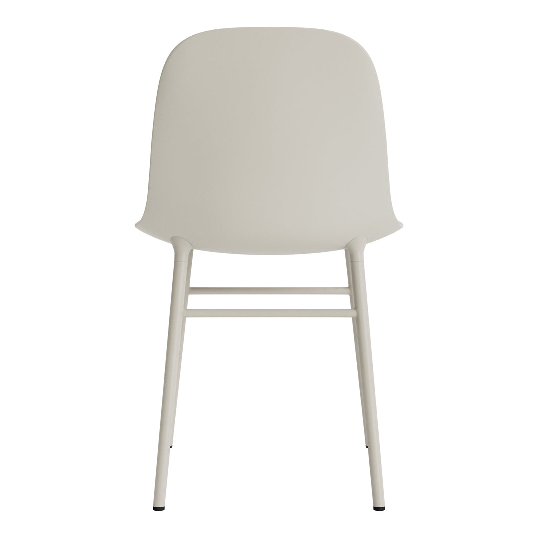 Minimalist cream chair with smooth contours and slender white legs, perfect for modern decor.