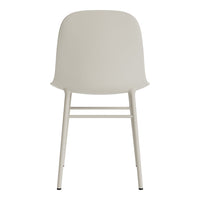 Minimalist cream chair with smooth contours and slender white legs, perfect for modern decor.