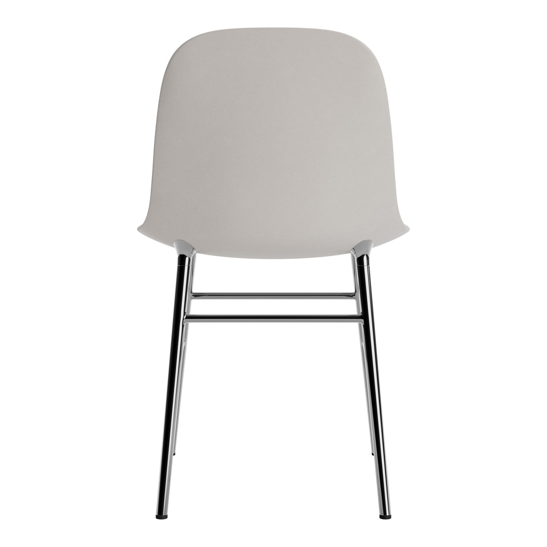 Gray molded chair with a smooth surface and sleek chrome legs, ideal for modern decor.