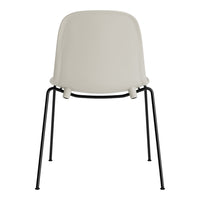 Modern beige chair with a smooth finish and sleek black metal legs, perfect for minimalist decor.