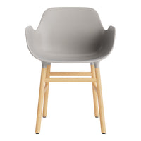Gray plastic chair with natural wood legs, featuring a minimalist design and smooth finish. Ideal for modern decor.