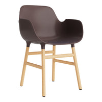 Brown plastic chair with natural wood legs, featuring a minimalist design and smooth finish. Perfect for modern decor.