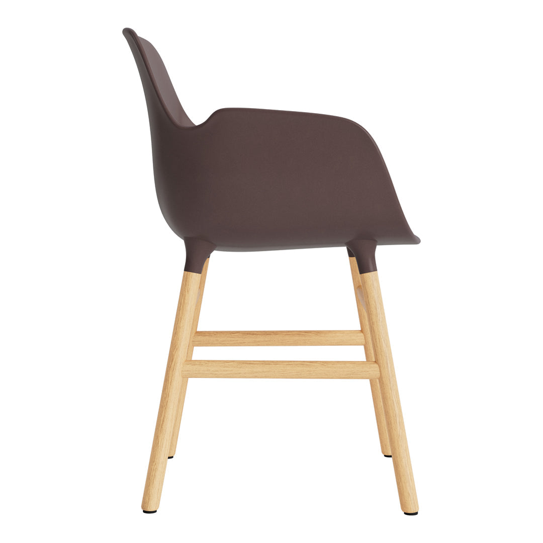 Brown molded chair with light wooden legs, featuring a smooth, minimalist design. Ideal for modern decor.