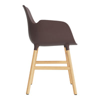 Brown molded chair with light wooden legs, featuring a smooth, minimalist design. Ideal for modern decor.
