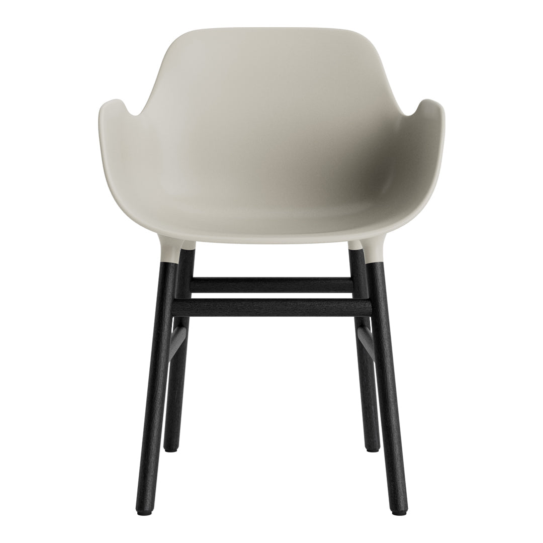 Light gray chair with smooth, curved design and black wooden legs, ideal for modern interiors and minimalist aesthetics.