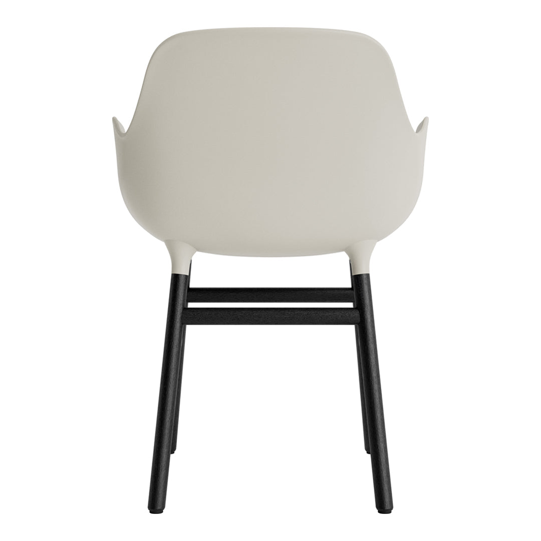 Light beige chair with black legs, featuring a sleek, minimalist design. Perfect for modern interiors.