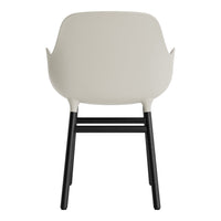 Light beige chair with black legs, featuring a sleek, minimalist design. Perfect for modern interiors.