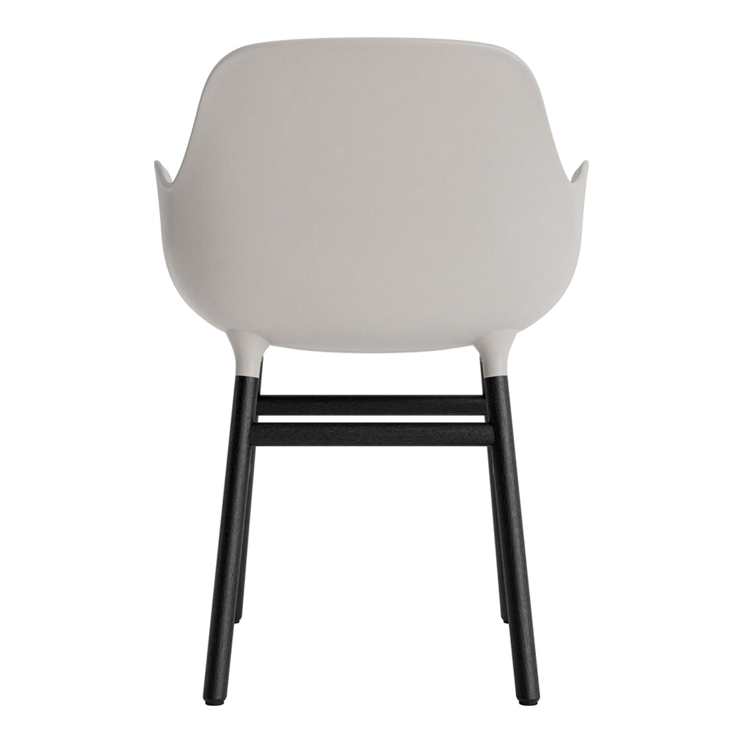 Light gray chair with black legs, featuring a smooth, modern design and minimalist aesthetic.