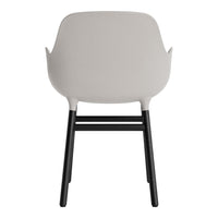 Light gray chair with black legs, featuring a smooth, modern design and minimalist aesthetic.