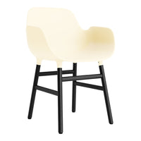 Cream-colored chair with a smooth design and black wooden legs, combining modern aesthetics with comfort.