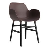 Modern brown plastic chair with a sleek black wooden frame, featuring a smooth, solid color design.