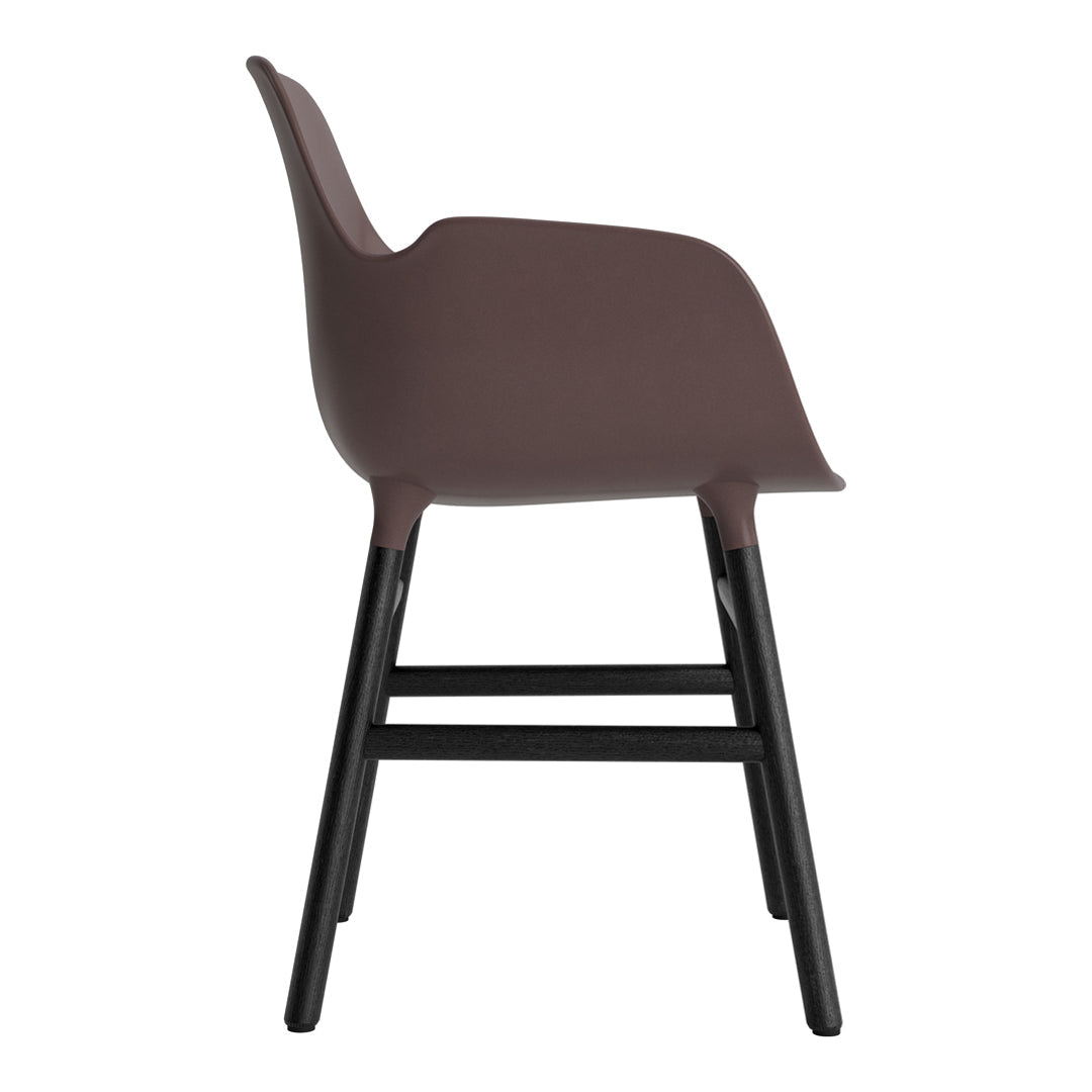Brown plastic chair with a sleek, minimalist design and contrasting black wooden legs.