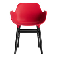 Bright red chair with a curved back, featuring sleek black legs for a modern touch. Ideal for any contemporary space.