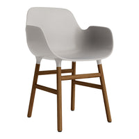 Light gray molded chair with wooden legs, featuring a smooth, minimalist design and modern aesthetic.