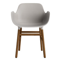 Modern white curved chair with wooden legs, showcasing a sleek minimalist design. Ideal for contemporary settings.