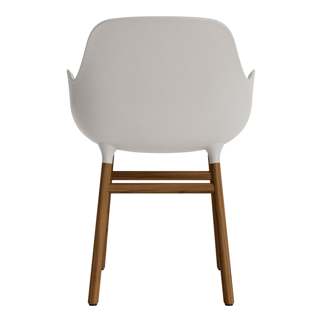 White armchair with a smooth finish and natural wood legs, showcasing a minimalist design and elegant color contrast.