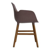 Side view of a sleek, muted brown chair with a smooth finish and wooden legs for a contemporary look.