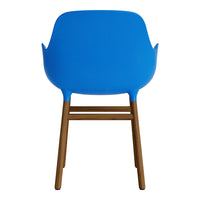 Bright blue chair with a smooth, rounded back and natural wood legs, perfect for modern decor.