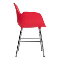 Red molded plastic chair with a sleek chrome frame, perfect for modern decor.