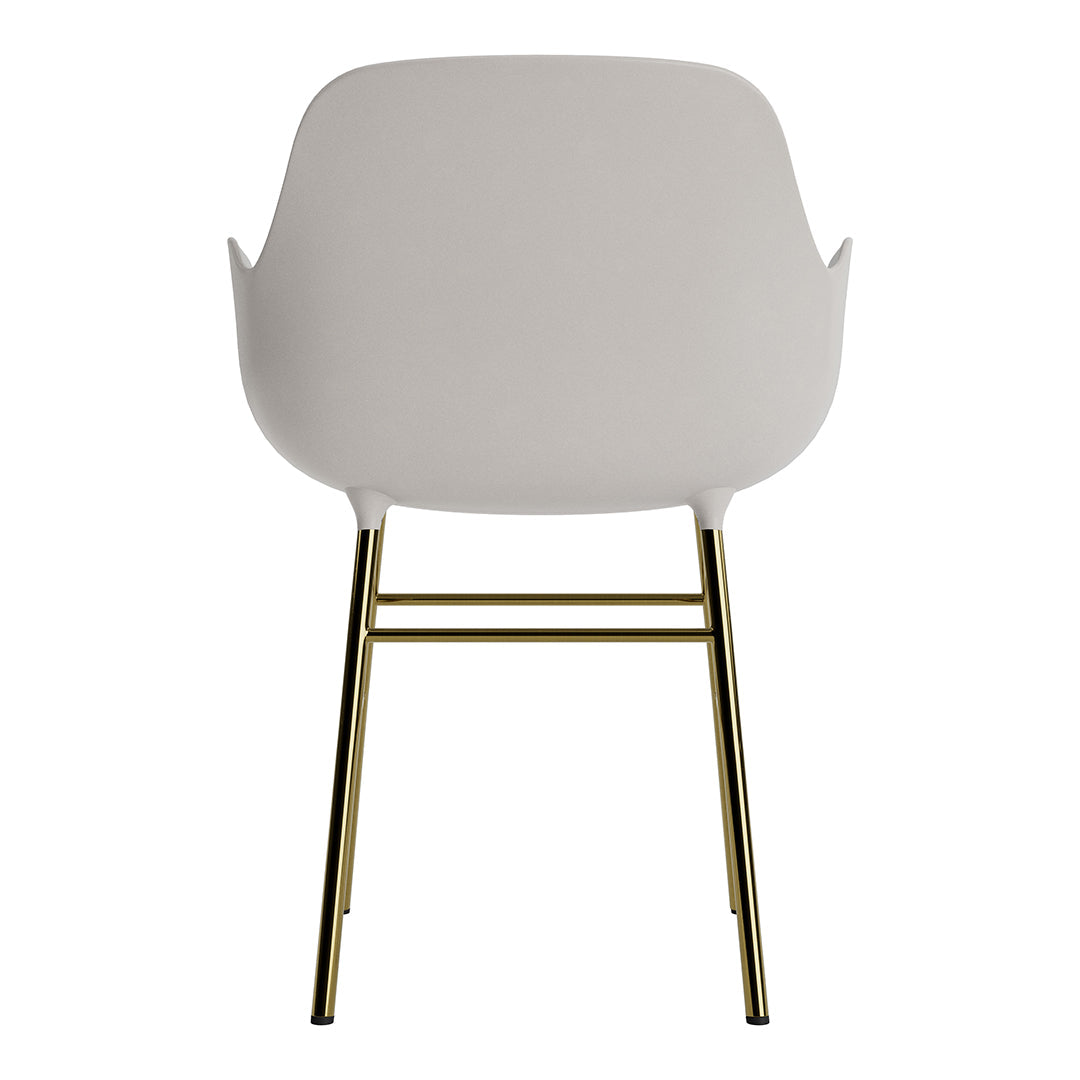 Light gray chair with gold metal legs, featuring a minimalist design and smooth, modern contours.