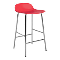 Red modern bar stool with a smooth finish and sleek chrome legs, adding a pop of color to any space.