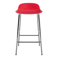 Bright red bar stool with a smooth, minimalist design and sleek chrome legs. Perfect for modern interiors.