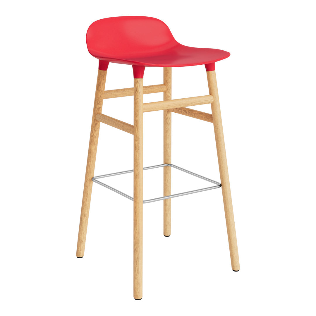 Bright red bar stool with a smooth seat and natural wood legs, featuring a minimalist design and modern aesthetic.