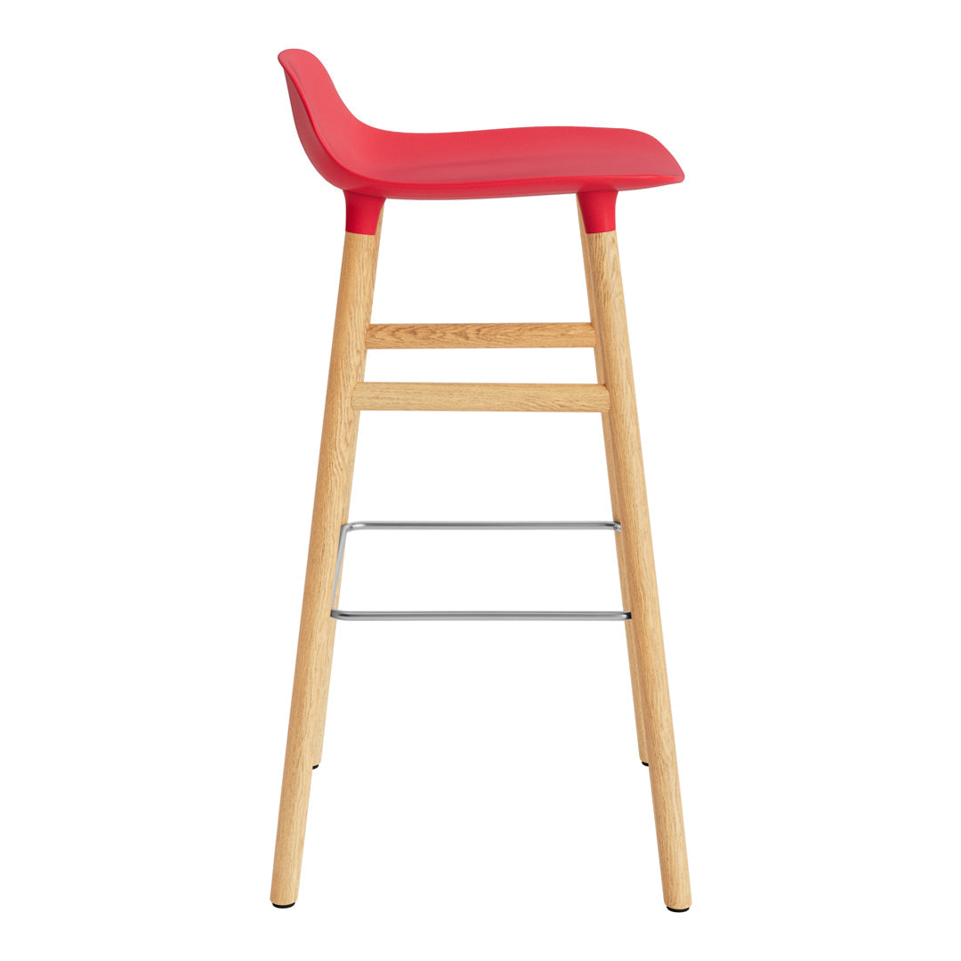 Red bar stool with a sleek curved seat and natural wooden legs, featuring a minimalist design.