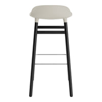 Modern bar stool featuring a sleek gray seat and contrasting black legs with a minimalist design.