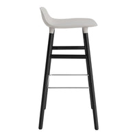 White stool seat with black legs and a silver footrest, featuring a minimalist and modern design.
