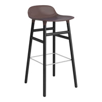 Brown plastic bar stool with black wooden legs and a silver footrest, featuring a sleek, minimalist design.