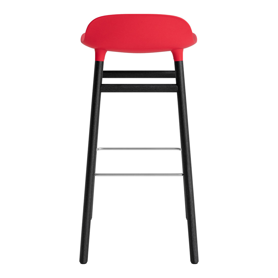 Red bar stool with a sleek black frame and minimalist design. Modern aesthetic with vibrant color contrast.