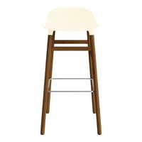 Cream-colored seat on a brown wooden frame with a silver footrest, featuring a sleek modern design.