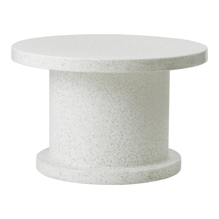 Round white speckled table with a smooth finish and cylindrical pedestal base. Ideal for modern decor.