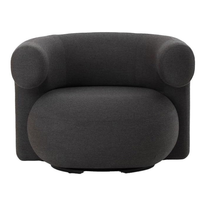 Stylish dark gray modern chair with rounded edges and a smooth, minimalist design. Perfect for contemporary decor.
