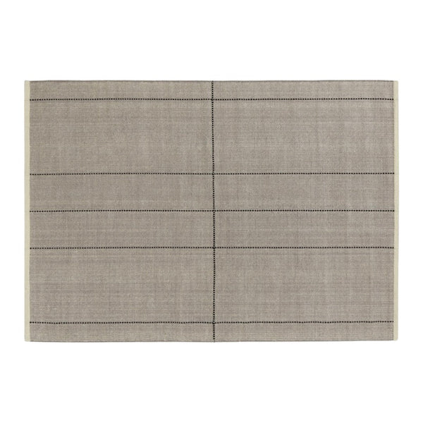 Gray placemat with a subtle texture and black dotted lines creating a grid pattern for a modern table setting.