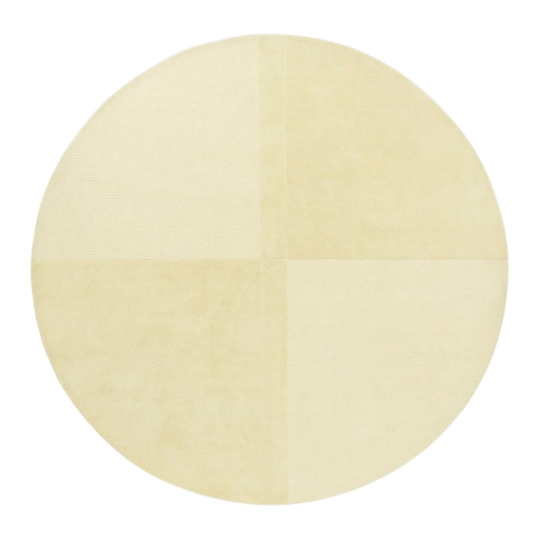 Round cream rug featuring a subtle grid pattern in soft beige tones. Ideal for modern and minimalist decor.