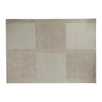 Beige geometric rug with varying shades and textures, featuring a modern patchwork design.
