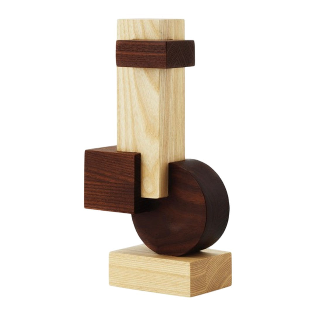 Wooden sculpture featuring light and dark wood tones with geometric shapes and smooth finishes.