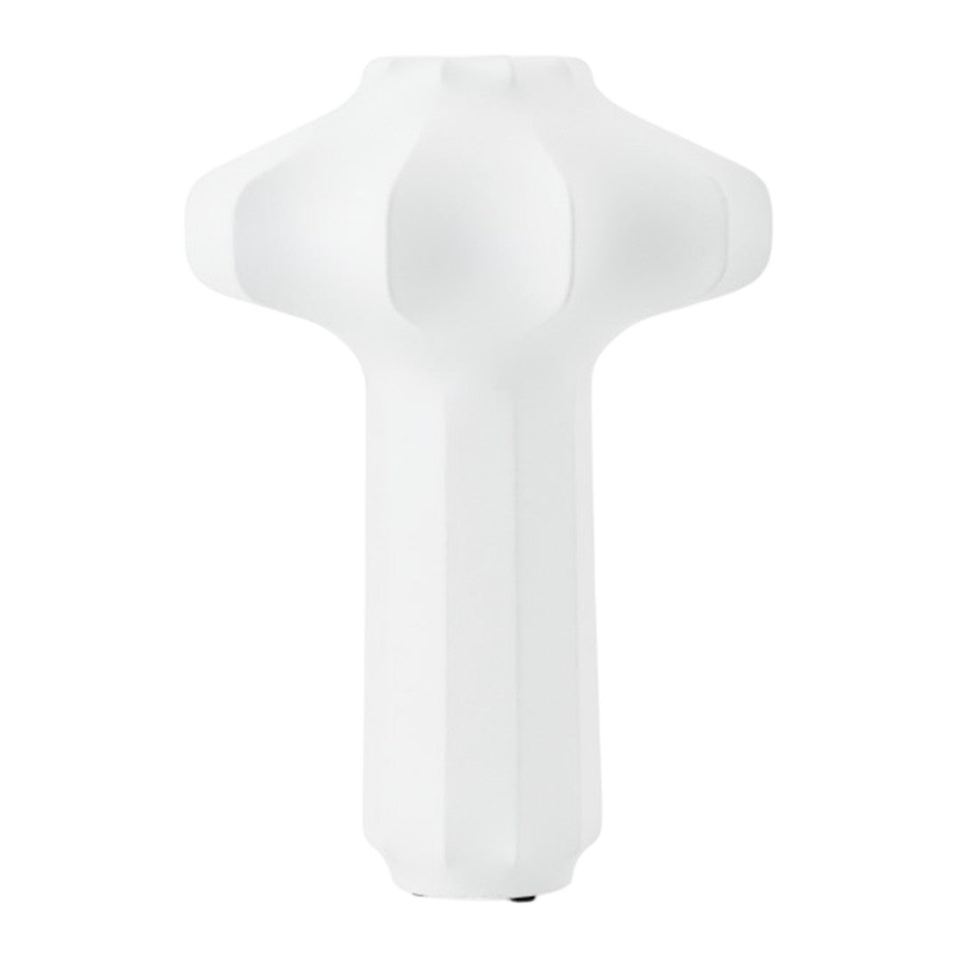 White sculptural lamp design with smooth surfaces and geometric patterns, perfect for modern decor.