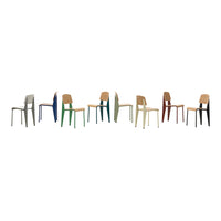 Colorful modern chairs in various shades, including green, blue, orange, gray, and natural wood tones, lined up.