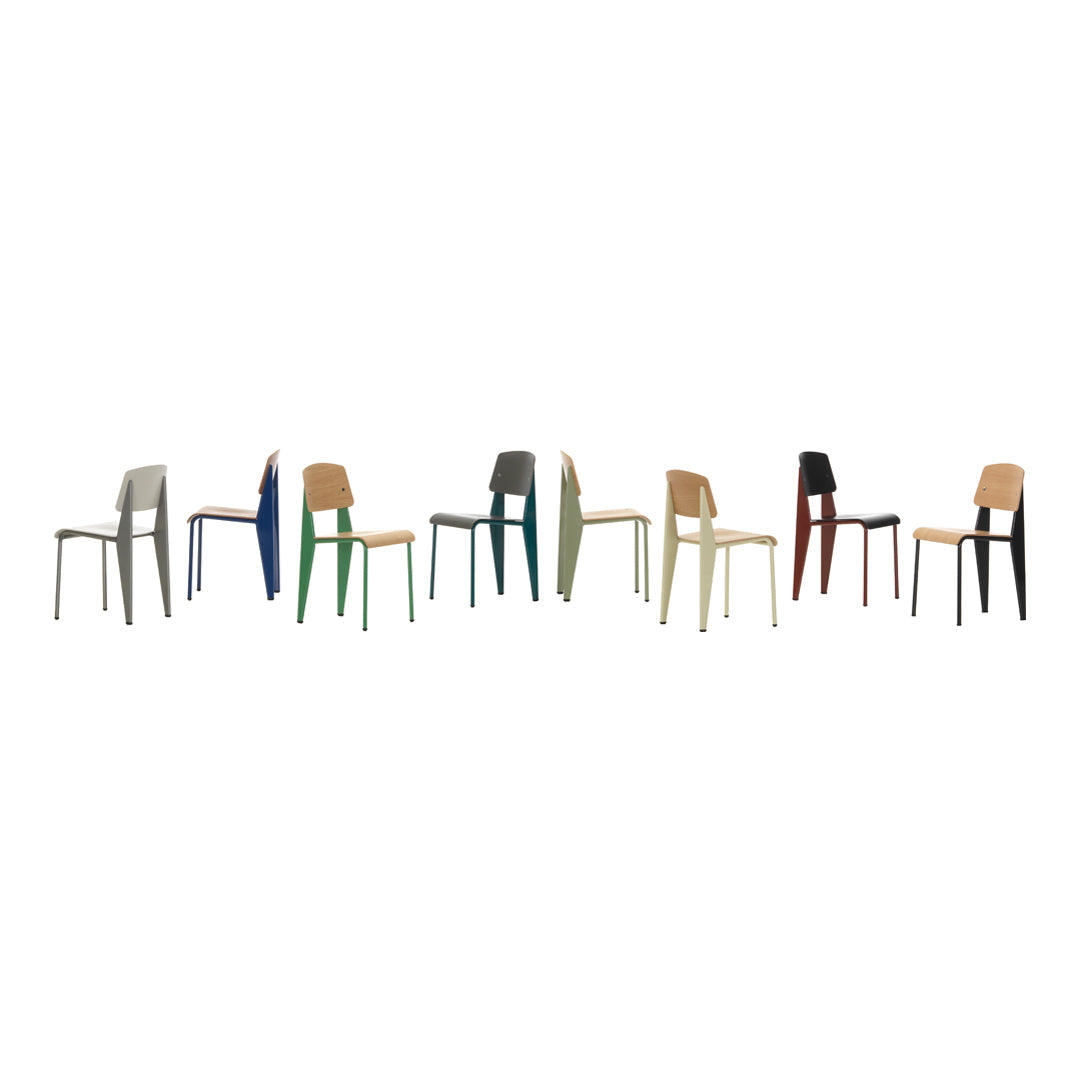 "Colorful modern chairs in various hues, including blue, green, beige, black, and red, with minimalistic design."