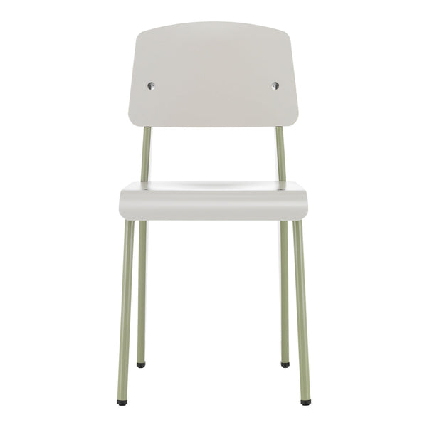 Minimalist white chair with pale green metal legs, featuring a sleek, contemporary design. Perfect for modern decor.