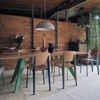 "Modern dining set featuring earthy wood tones, vibrant green and blue accents, and a stylish contemporary design."