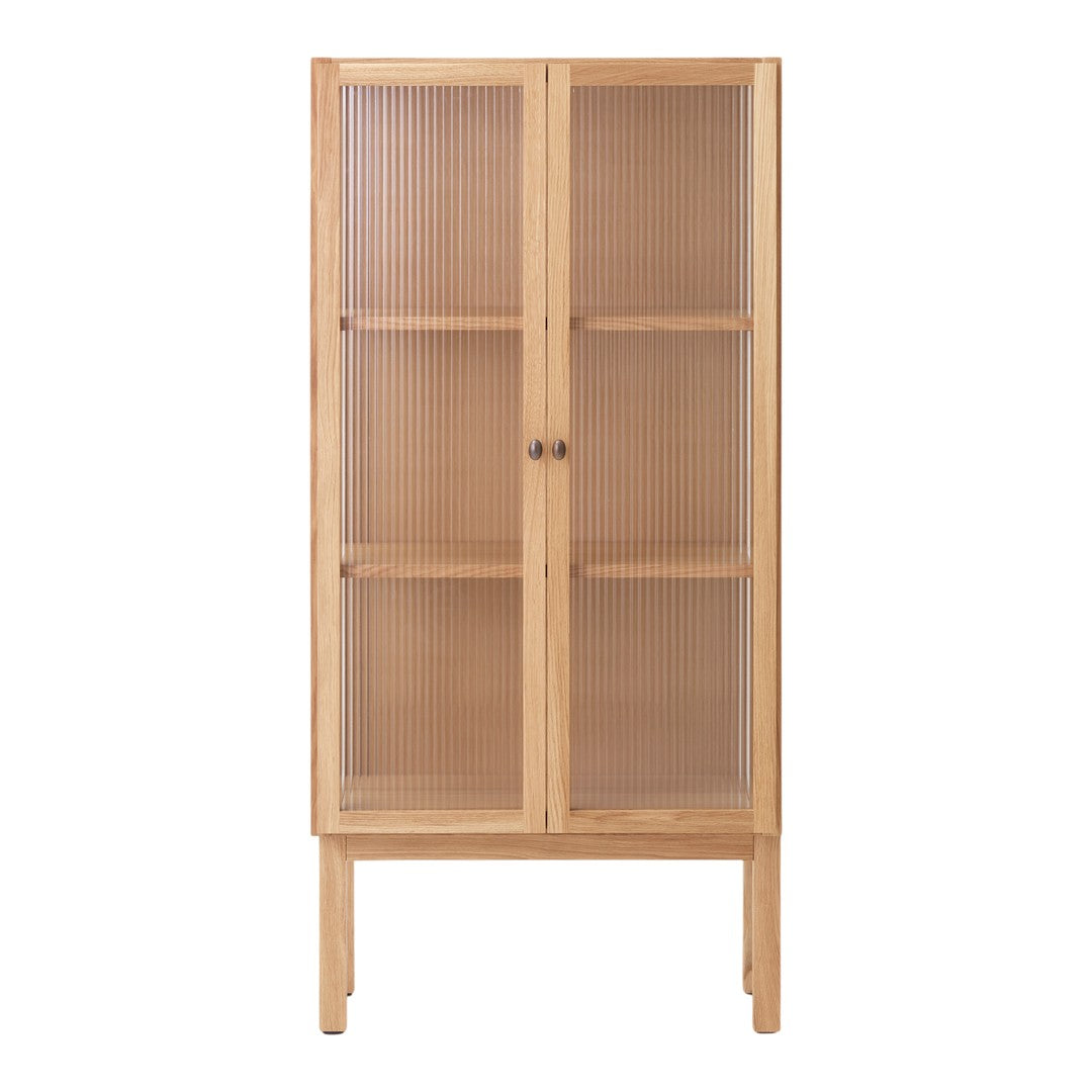 Natural wood cabinet with a light finish and ribbed glass doors, showcasing a minimalist, contemporary design.